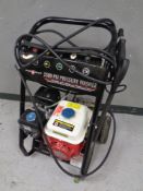 A Swiss Kraft 2500 PSI pressure washer on trolley
