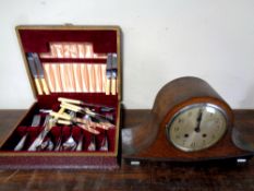 A 1930s oak cased mantel clock with silvered dial together with a canteen of stainless steel