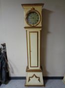 A continental painted longcase clock with circular dial