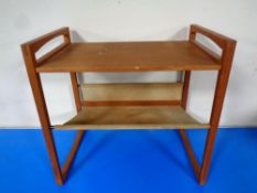 A mid 20th century Danish teak magazine table