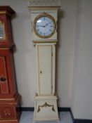 A continental painted longcase clock with circular dial