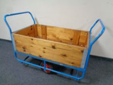 A metal and pine porter's trolley