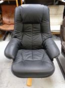 A Scandinavian beech framed high backed swivel armchair