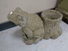A concrete frog planter