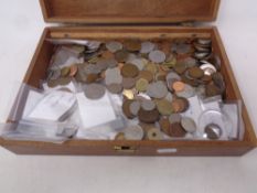 A wooden box containing a large quantity of pre decimal British coinage,