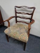 A 19th century ladder back armchair