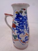 An antique hand painted porcelain jug, height 12.
