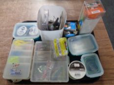 A tray containing fishing equipment to include rig rappers, weights, line,