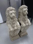 A pair of concrete garden statues,
