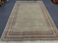 A Persian carpet on green ground,