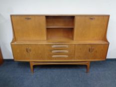 A mid 20th century teak G Plan cocktail high board,