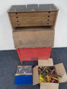 A wooden tool chest fitted three internal drawers on a metal mechanics trolley together with a