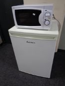 A Lec under bench fridge together with a microwave