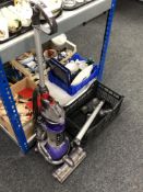 A Dyson DC 24 upright ball vacuum with accessories