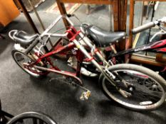 A Schwinn Stingray bike in the form of a chopper, red.