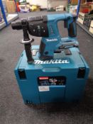 A Makita 36 V hammer drill in plastic case (no battery)