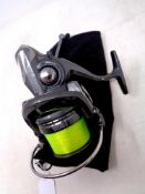 A Daiwa Emcast Spod N Mark reel in a cloth carry bag