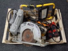 A box containing Makita 110 V circular saw, sight lamp, Allen keys,