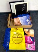 A box containing Elvis Presley memorabilia to include lap trays, flag, throws,