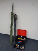 A fishing box containing reels, fishing equipment,