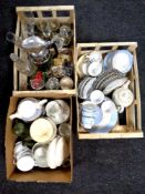 A box and two crates containing assorted dinnerware, drinking glasses, a Tiger flask,