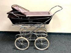 A mid century Silver Cross perambulator.