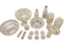 A collection of Victorian and later cut crystal and pressed glass to include bowls, knife rests,