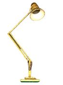 An early twentieth century angle poise lamp.