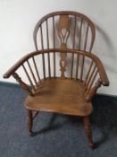 A 19th century elm and beech elbow chair