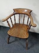 An antique elm and beech smoker's armchair