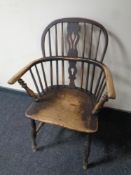 A 19th century elm and beech elbow chair