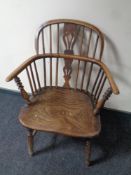A 19th century elm and beech elbow chair