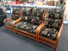 A three piece bamboo and wicker conservatory suite