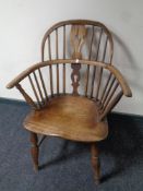 A 19th century elm and beech elbow chair