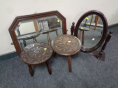 Two carved tripod stools,