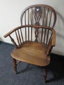 A 19th century elm and beech elbow chair