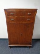 A 1920's oak linen cabinet