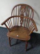 A 19th century elm and beech elbow chair