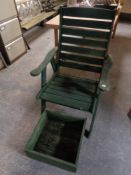 A wooden garden armchair together with a planter