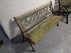 A cast iron wooden slatted garden bench