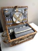 A wicker cased picnic set