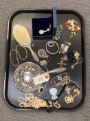 A quantity of costume jewellery, mirror, brush, necklace etc.