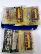 Three tin plated Jouets En Fer-blanc trams with magazines together with further mechanical man on