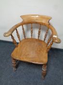 An antique elm and beech smoker's armchair