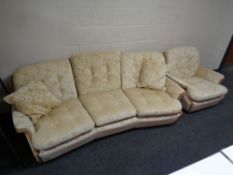 A late twentieth century wooden framed shaped settee upholstered in golden fabric in the style of