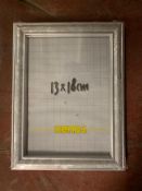 Nineteen Xenos photo frames in silvered finish, 13 cm x 18 cm, all brand new and still wrapped.