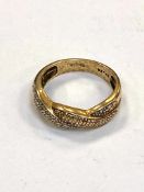 A 14ct yellow gold dress ring set with diamond chips, 3.9g.