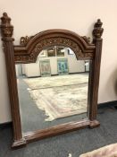 A contemporary bevelled mirror with pillared sides, width 104 cm,