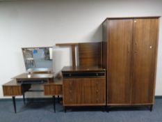A 20th century teak four piece bedroom suite : 4'6 headboard, double door wardrobe,