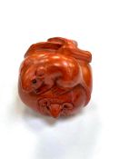 A Japanese carved fruitwood netsuke - Rats on a pumpkin.